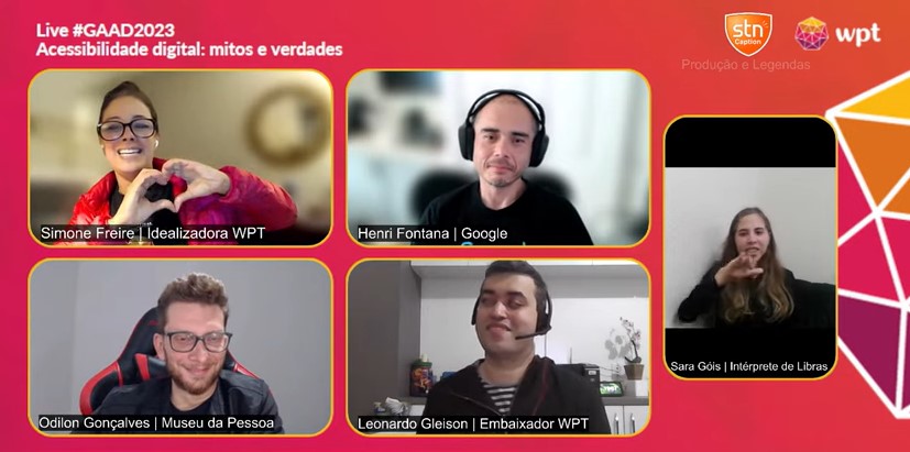 Print de tela da live #GAAD2023, Acessibilidade digital: mitos e verdades. Na tela, sob um fundo rosa escuro, há as imagens de Simone Freire, Henri Fontana, Odilon Gonçalves, Leonardo Gleison e Sara Gois, intérprete de Libras. Há os logos do WPT e da STN Caption.